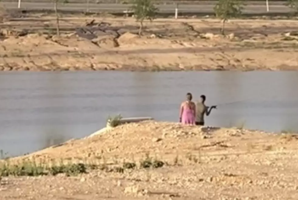Lubbock College Students Try to Fish in a Ditch Full of Rainwater