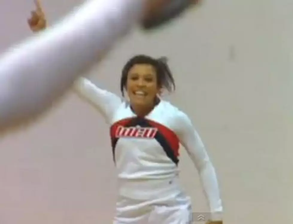 Watch a Cheerleader Make a Half-Court Shot While Doing a Front Flip