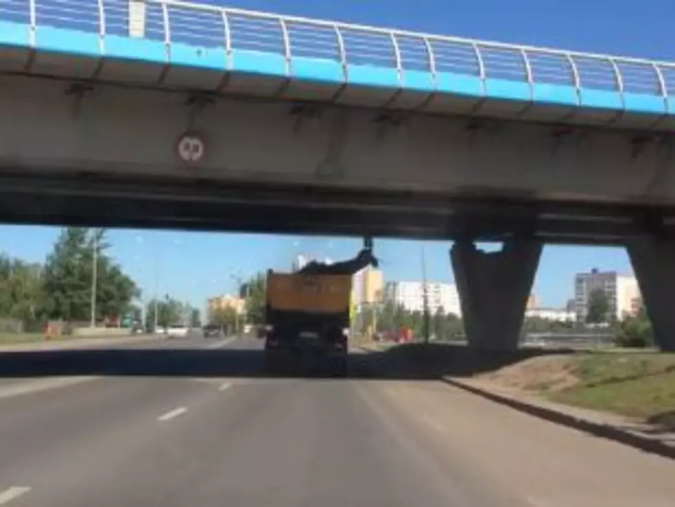 A Giant Deer Statue That’s Being Hauled by a Trucker Fails to Clear an Overpass