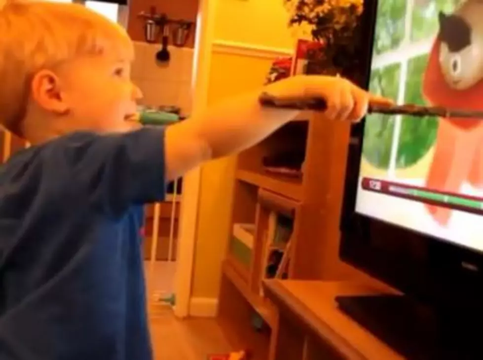 A Toddler Thinks He Can Control the TV with His Magic Wand