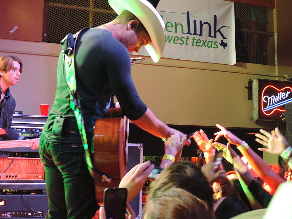 Dustin Lynch Autographs Everything at the Taste Of Country Christmas Concert In Lubbock [Photos]