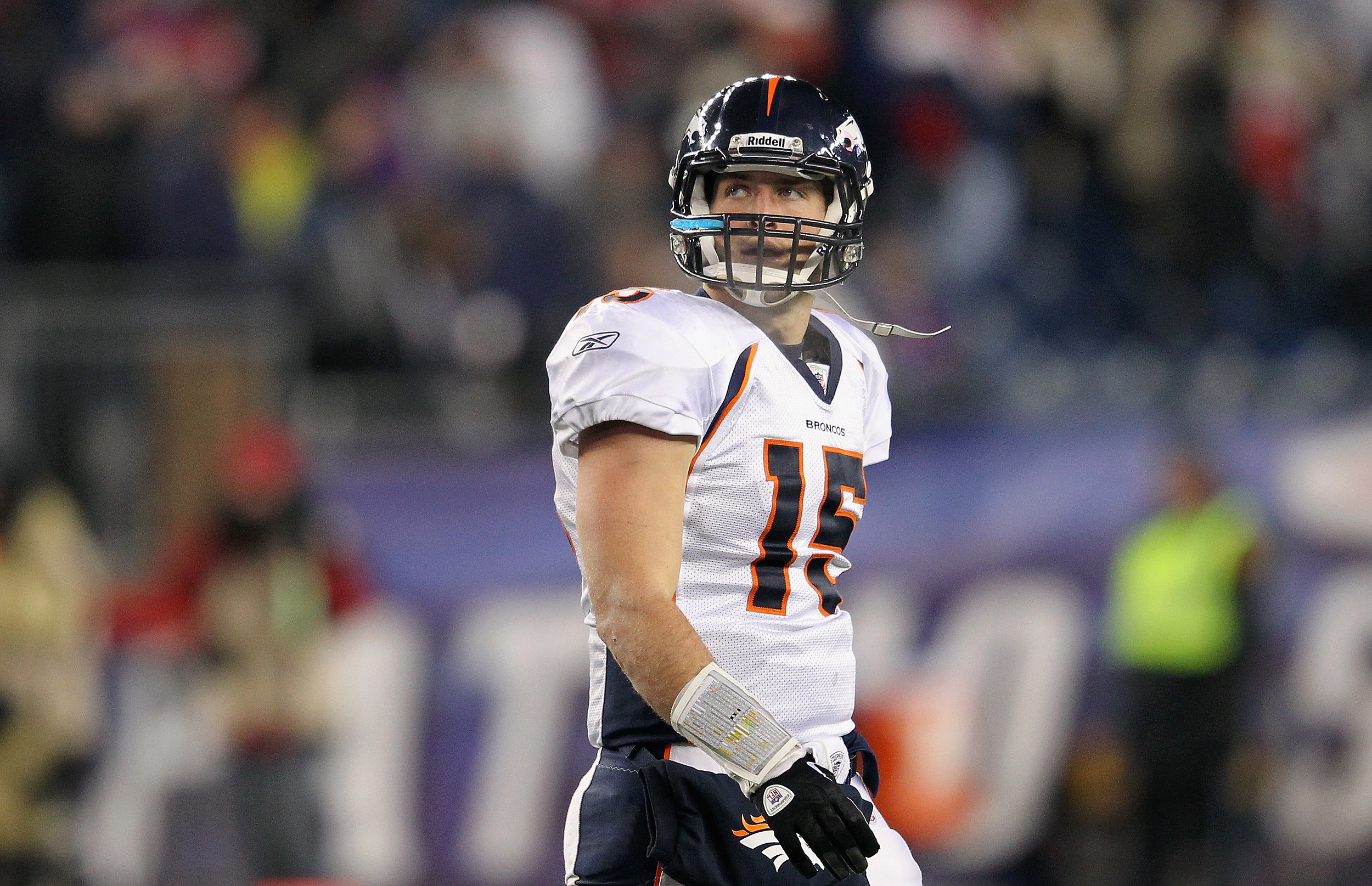 Quarterback Tim Tebow of the Denver Broncos runs against the