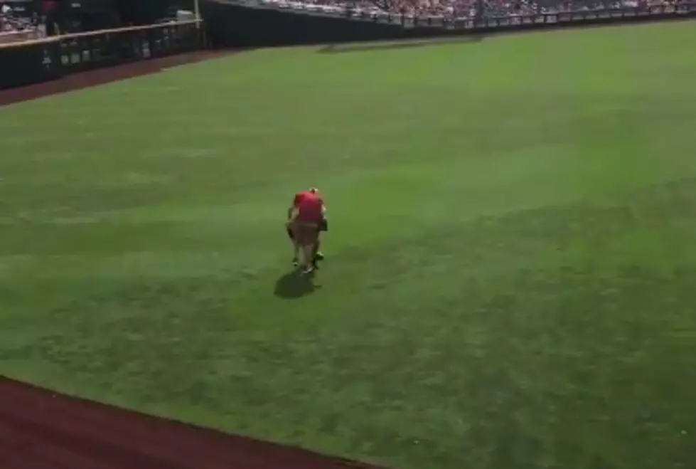 Arkansas Fan Gets Smoked By Security During Rain Delay