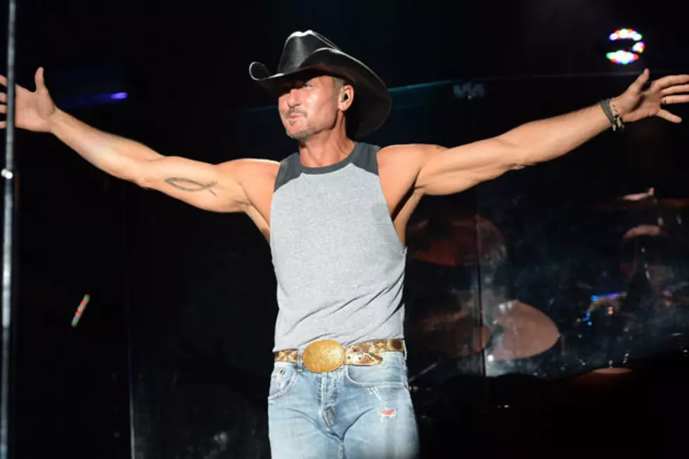 Tim McGraw Shows Off His Superhero Skills … And Super Abs!