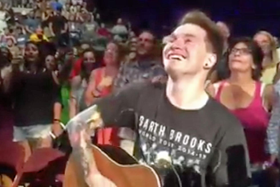 Tears Flow When Garth Brooks Gives Young Musician the Guitar on His Shoulder