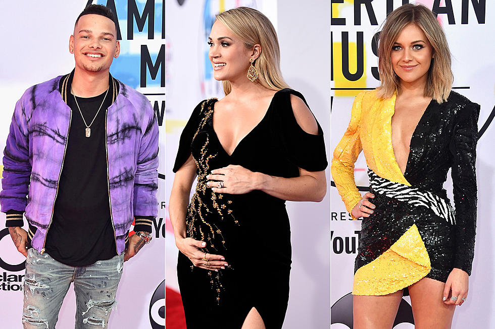 Carrie Underwood Cradles Baby Bump on the Red Carpet for 2018 AMA's