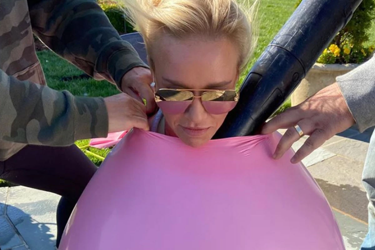 WATCH Luke Bryans Wife Stuffs Herself Into Giant Pink Ballooon photo