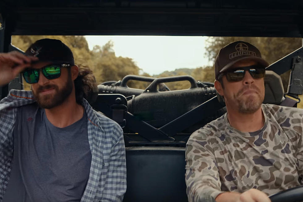 Dustin Lynch and Riley Green Face a Country Boy&#8217;s Conundrum in &#8216;Huntin&#8217; Land&#8217; Video [Watch]