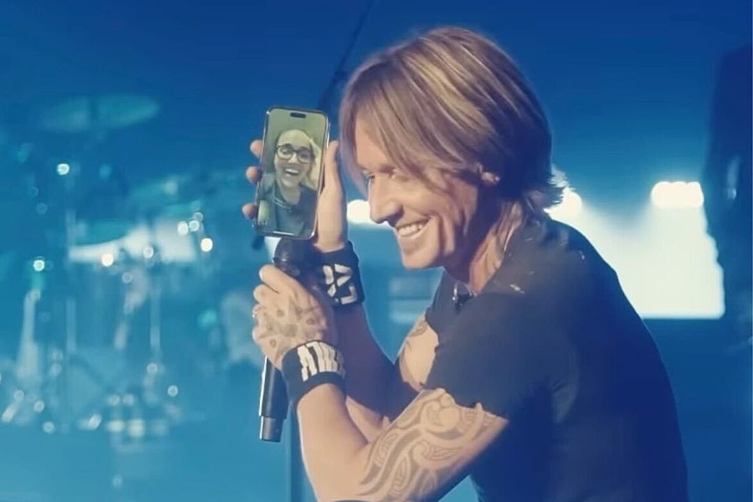 Keith Urban hugging a friend as he arrives to film an episode of
