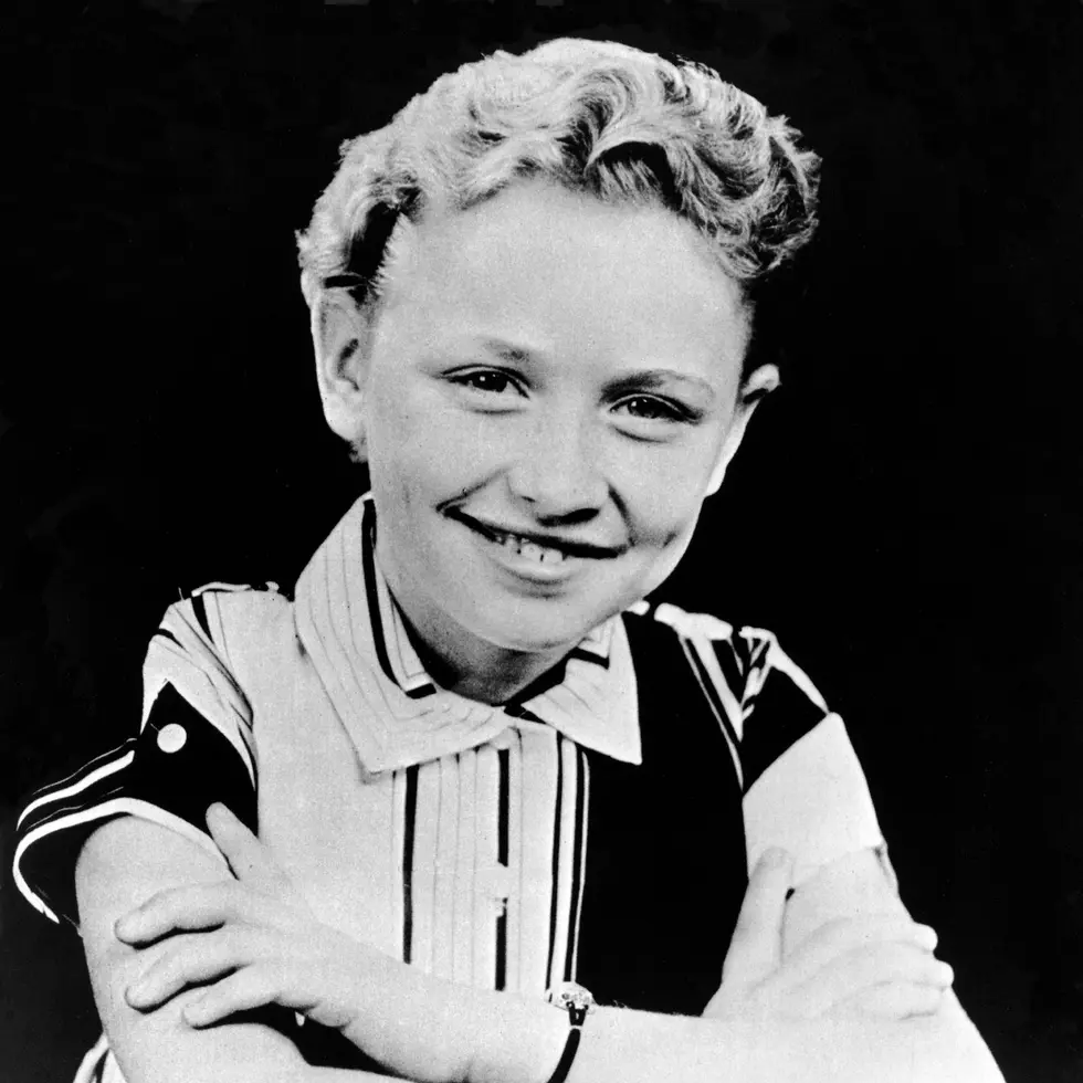 Dolly Parton poses for a portrait, c. 1955 in Tennessee