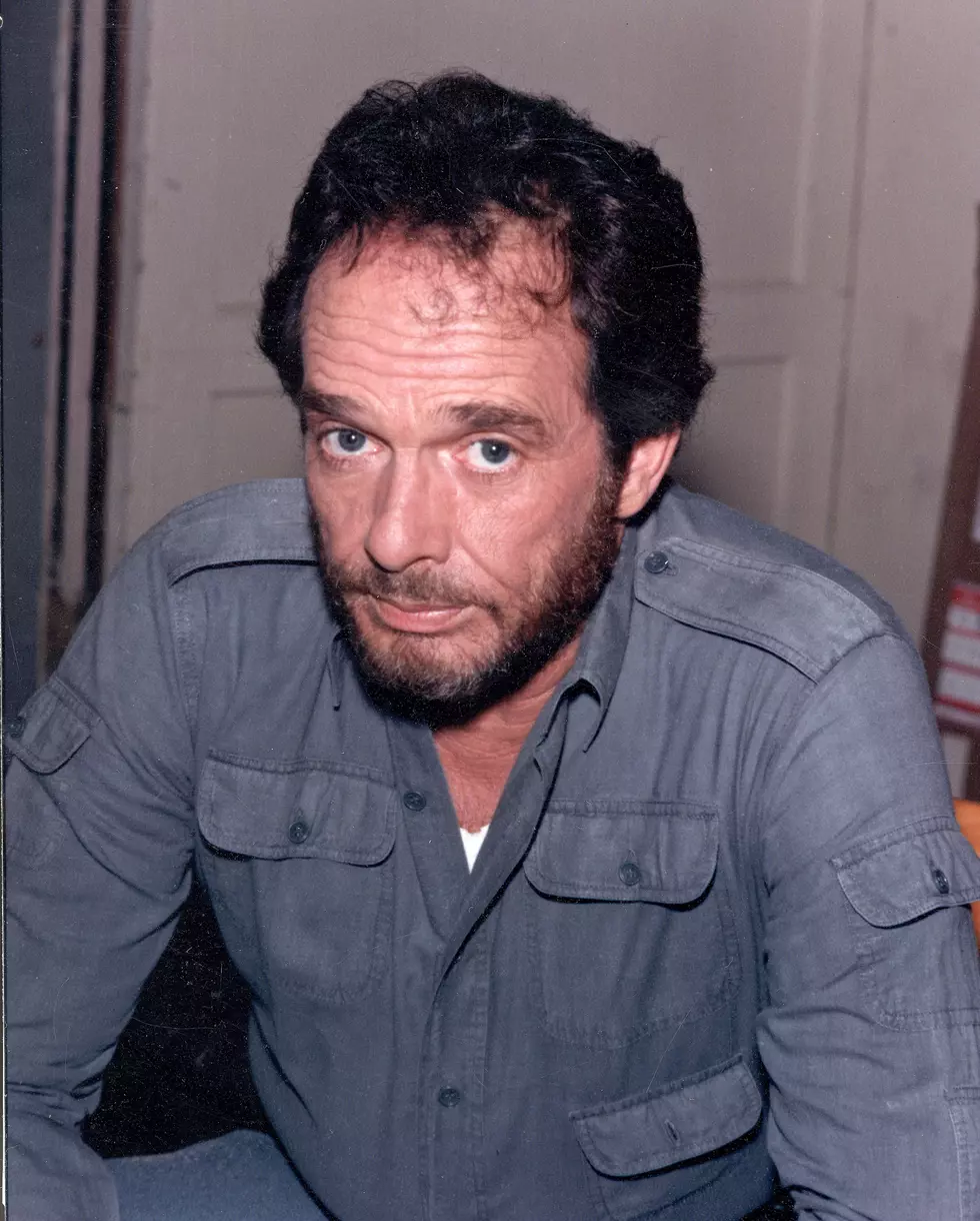 Picture of Merle haggard with a description of His felony charge