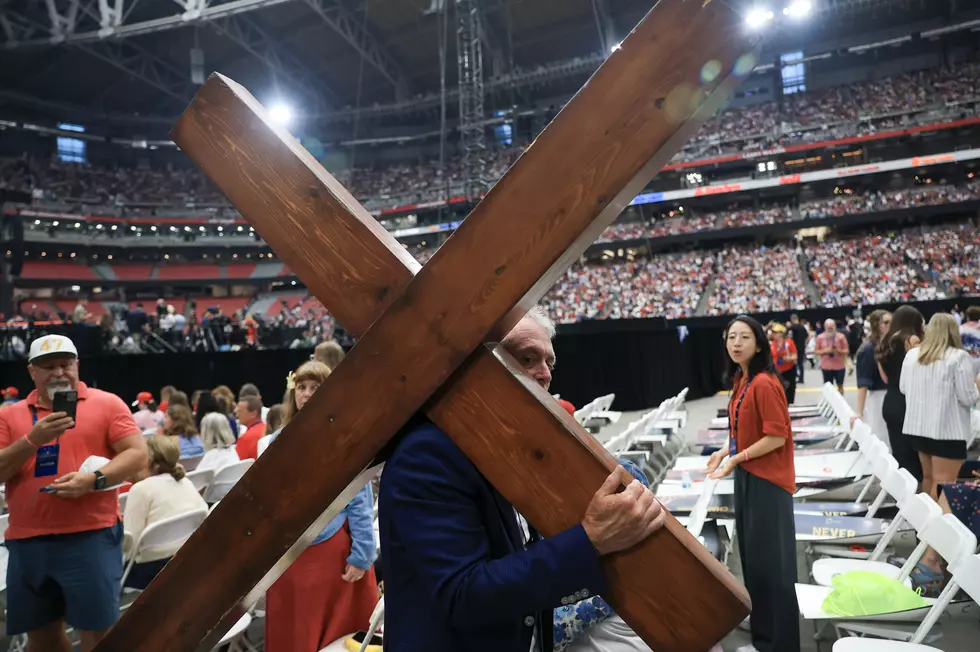A Man Carries a Cross