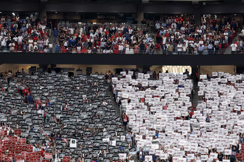 Charlie Kirk Memorial Attendees Holding Signs for Turning Point USA