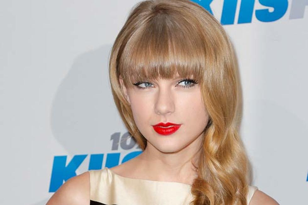 Taylor Swift Channels Coco Chanel in Striped Dress on Jingle Ball Red Carpet