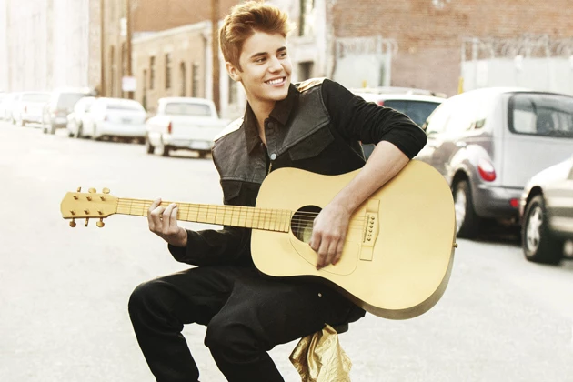 Win an Acoustic Guitar Signed by Justin Bieber