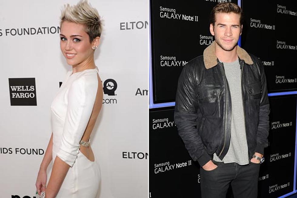 Miley Cyrus + Liam Hemsworth Postpone Wedding, But Are Still Together