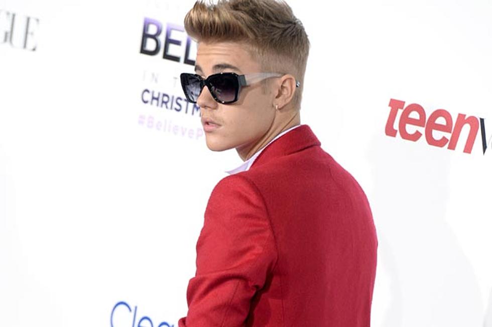 Justin Bieber Dons Red Suit, Smooches Mom at &#8216;Believe&#8217; Premiere [PHOTOS]
