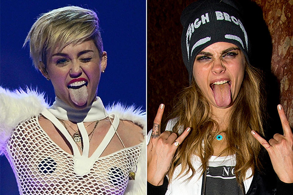Miley Cyrus + Cara Delevingne Touch Tongues [PHOTO]