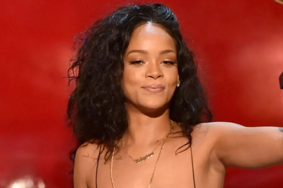 Rihanna Poses for Topless Photo While Holding Baby Niece