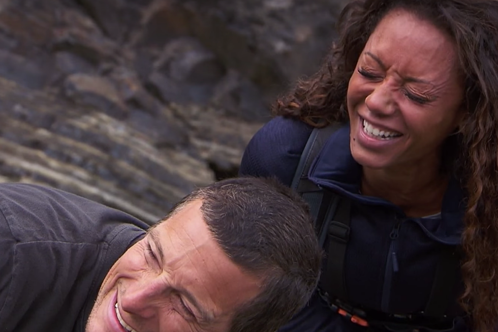Mel B Pees on Bear Grylls’ Hand, Ruins Picturesque Welsh Sea Cliff Views