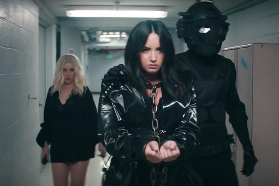 Xtina and Demi Lovato Fight the Man (Literally) in Fiercely Feminist ‘Fall in Line’