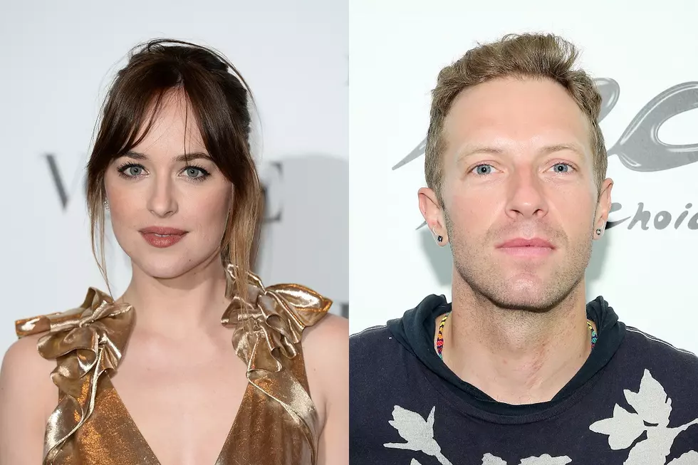Dakota Johnson and Coldplay’s Chris Martin Cuddle at Radiohead Concert