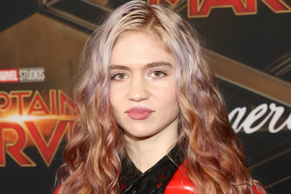 Did Grimes Remove Part of Her Eyeball in an Experimental Surgery?