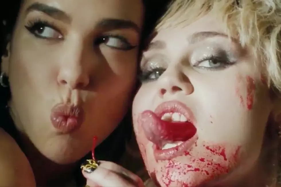 Miley Cyrus and Dua Lipa Get Covered in Cherry Juice for &#8216;Prisoner': WATCH