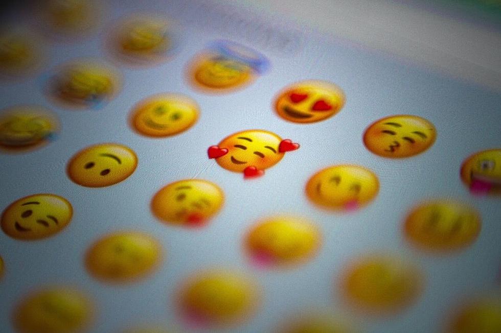 What new emojis are available on Apple's iOS 15.4?