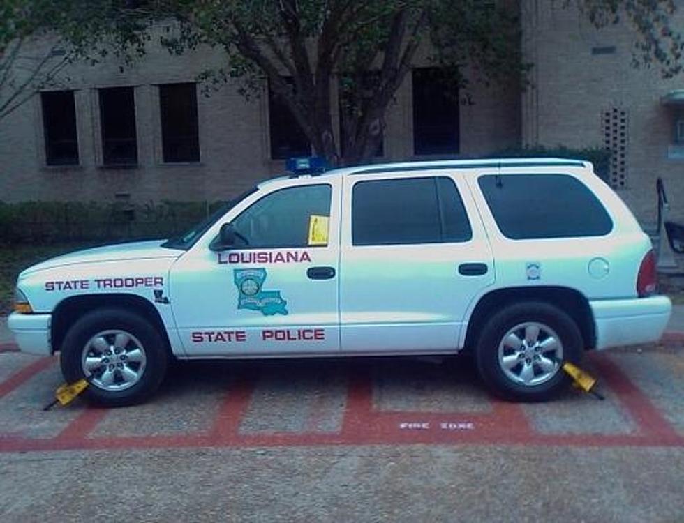 Old Photo Shows LA State Police Vehicle Immobilized At McNeese State University