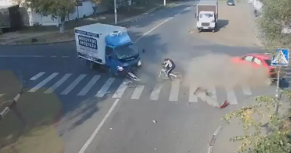 Russian Biker Narrowly Escapes Death [SEE TO BELIEVE VIDEO]