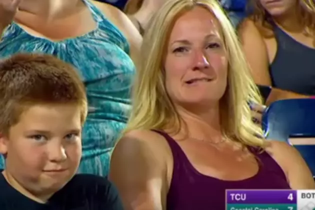 Watch Cute Kid Mug For The Camera At College World Series [Video]