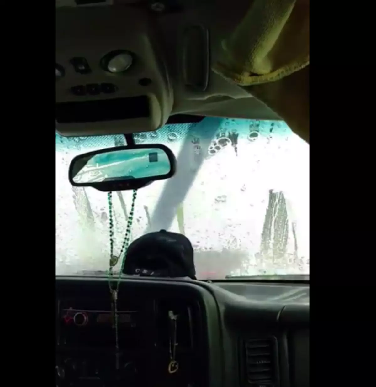 Woman Goes Through Car Wash With Open Sunroof