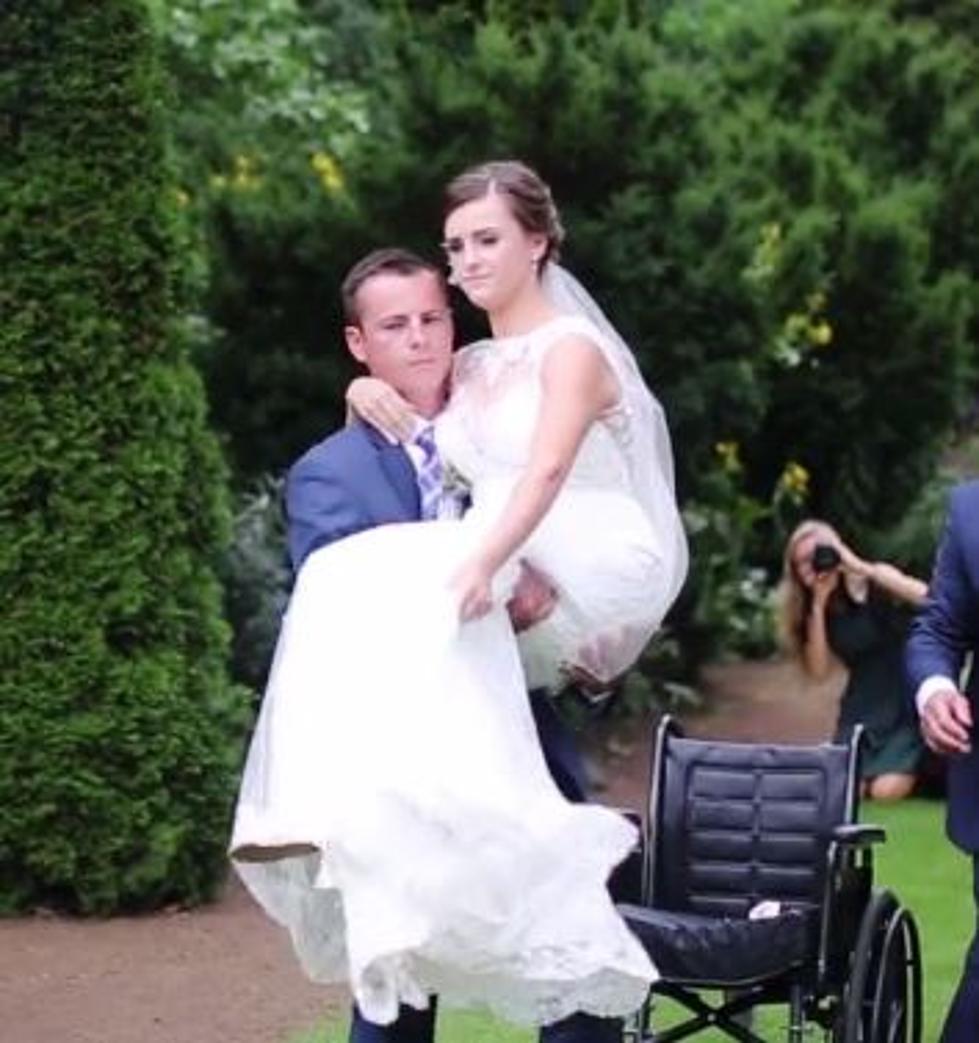Groom Carries Bride Down The Aisle [VIDEO]