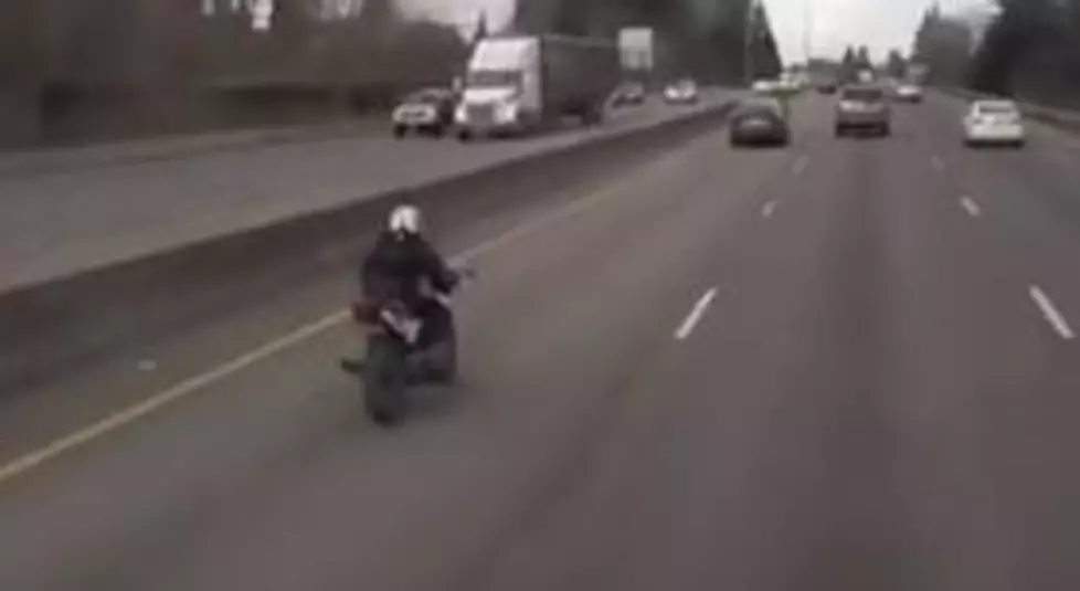 Motorcycle Rams Into A Car, Motorcyclist Ends Up Safe On The Trunk [VIDEO]