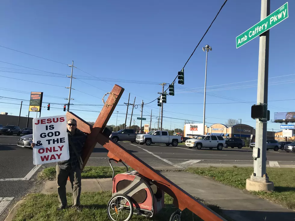 Who’s the Guy with the Cross on Ambassador at Johnston?