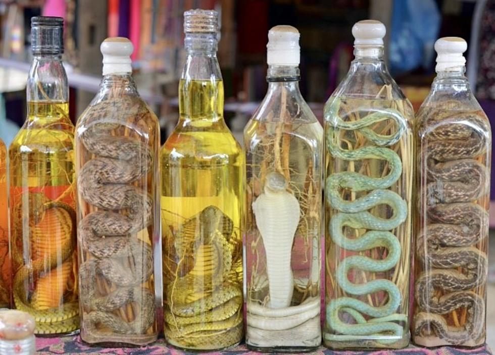 Man Opens Wine Bottles After One Year, Snakes Still Alive