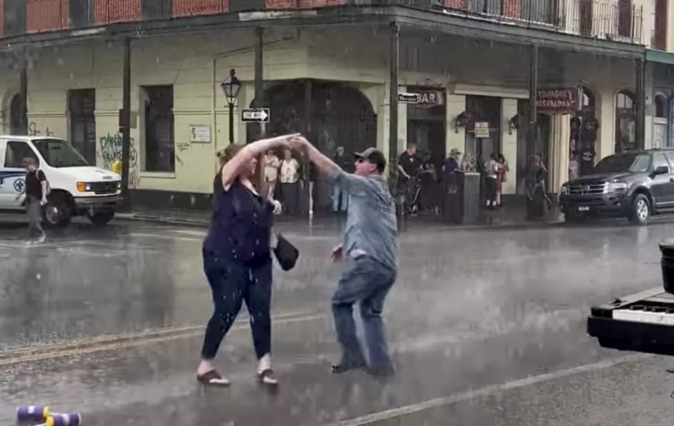 Who is the Couple Dancing in the Rain in the French Quarter?