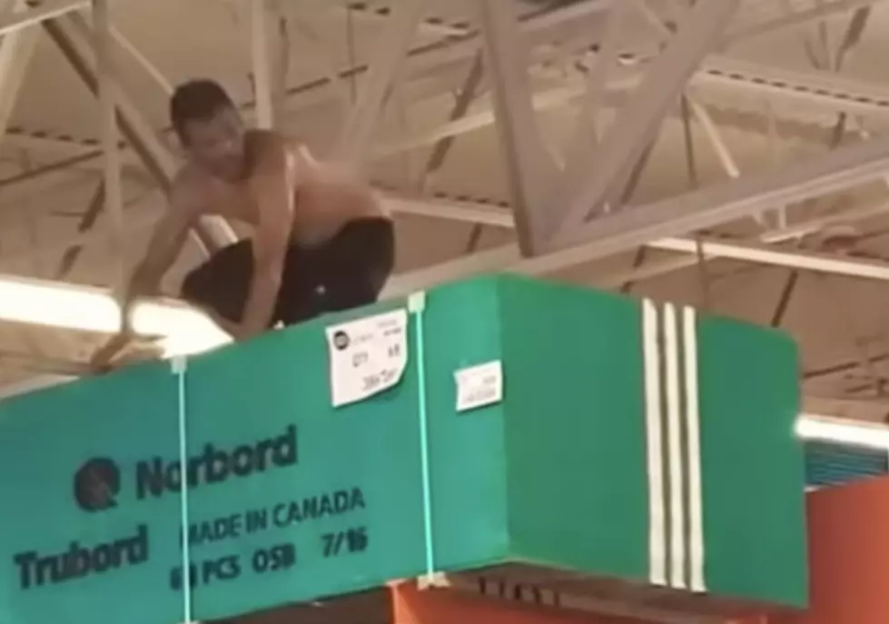 Guy Climbs to the Top of Home Depot—Blown Away by Sprinkler System
