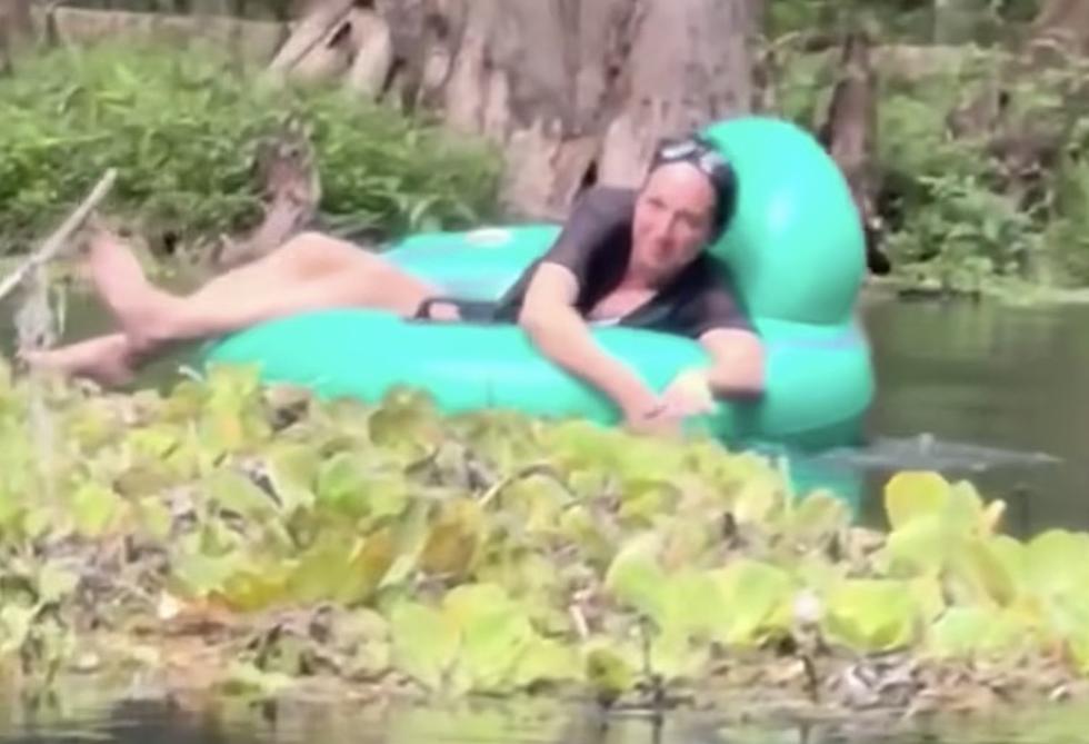 Woman Gets Dangerously Close to Alligator While Floating Down Lazy River [WATCH]