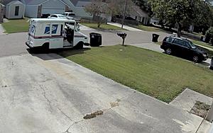Baton Rouge Mail Carrier Pushes Garbage Can Down the Street With...
