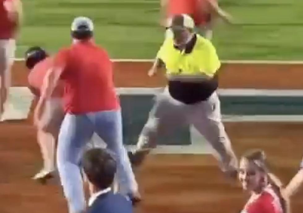 Hilarious Viral Video Shows Security Guard Failing to Stop Fans Rushing Field