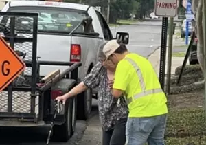 City Worker in Louisiana Seen Assisting Elderly Woman Across...