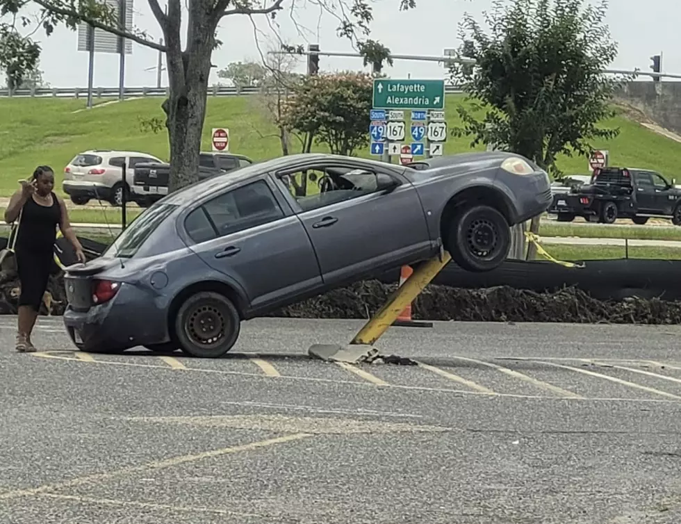 Car Hits and Climbs Pole in Louisiana Walmart Parking Lot