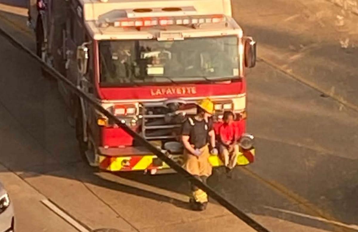 Lafayette Firefighter Sits Young Crash Victim On Fire Engine Bumper After Accident