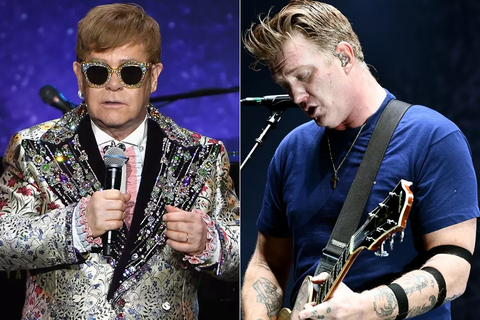 Watch Queens of the Stone Age Cover Elton John’s ‘Goodbye Yellow Brick Road’