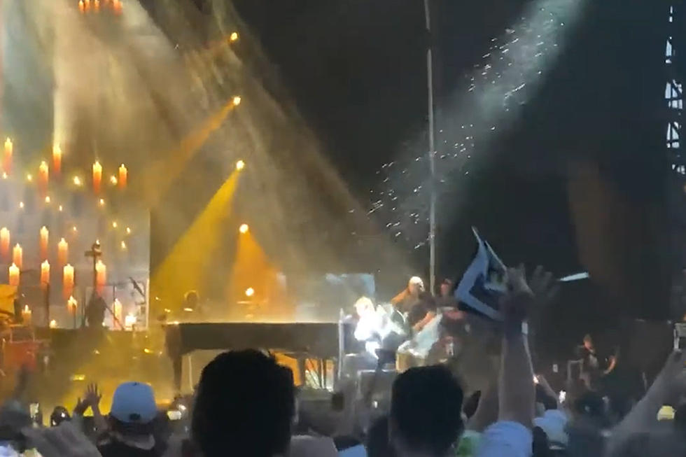 Watch Sudden Rain and Hail Force Elton John to End Concert