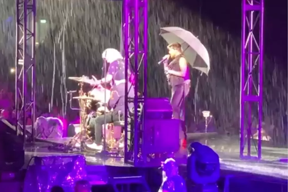 Watch Queen Brave Torrential Rains for 'Wettest Gig' Ever