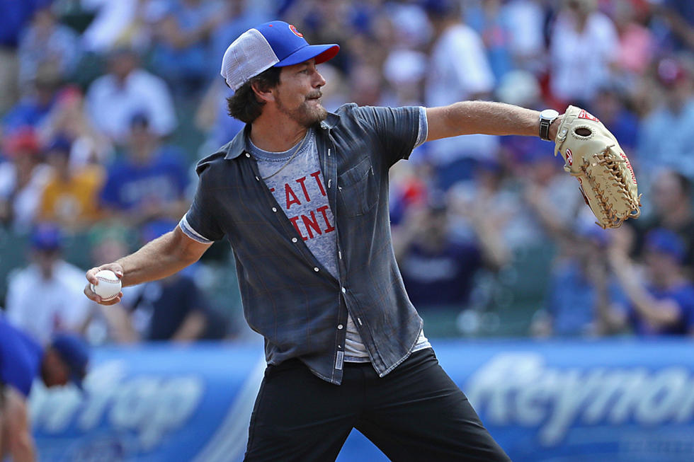 Eddie Vedder wore a batting helmet to throw a first pitch for the Mariners'  Pearl Jam Night