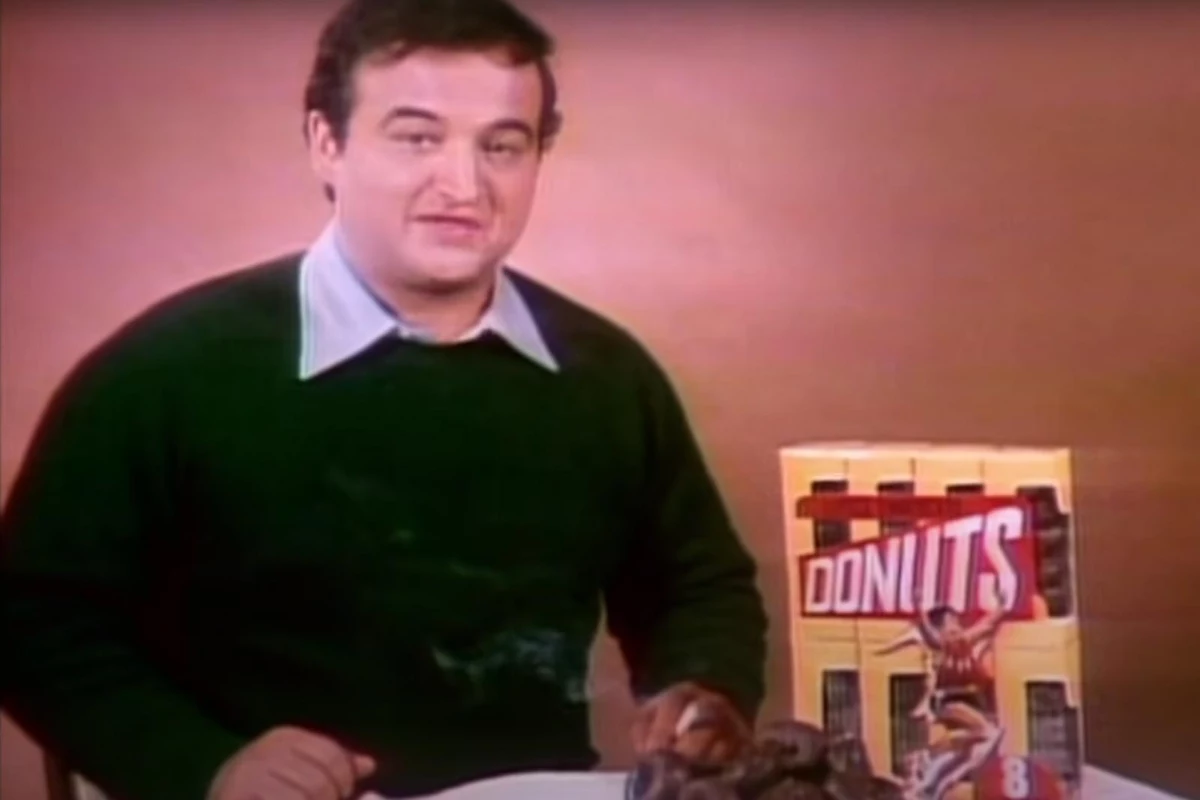 John Belushi offers small chocolate donuts